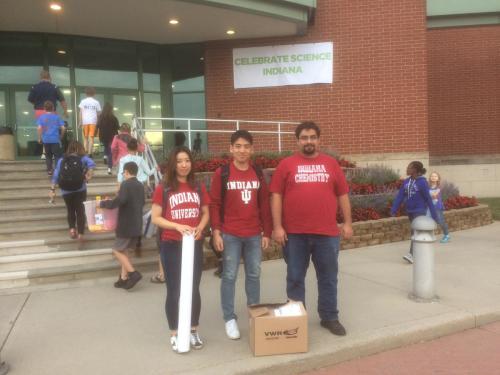 Ye group members posing in front of the building